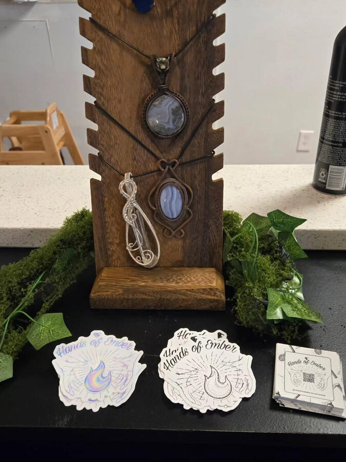 Untitled Showcase of necklaces and stickers in cafe